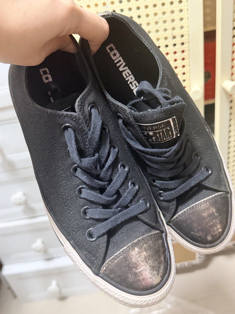 Converse All Star Black Low Top Sneakers (Category: Sneakers) located in Marikina City. Submitted by ukayshopping (Listing ID 1466768191, Image 2). Description: - Brand: Converse All Star - Style: Low-top sneakers - Color: Black with metallic worn-finish toe caps - Size: EUR 38 / UK 5 / 24.5 cm - Details: Black laces, black inner lining, and tongue logo patch - Condition: Minor wear on rubber outsoles - Origin: Made in Vietnam Slightly used and S
