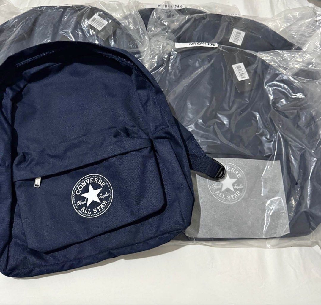 Converse All Star Navy Blue Backpack (Category: Backpacks) located in Angeles City. Submitted by msskyve (Listing ID 1466606613, Image 1). Description: - Brand: Converse - Color: Dark Navy Blue - Material: 100% Polyester - Design: Classic Chuck Taylor All Star patch on front pocket - Compartments: Zip closure main compartment with interior zippered pocket and branded tag - Straps: Adjustable with black plastic adjusters - Condition: Brand new wit