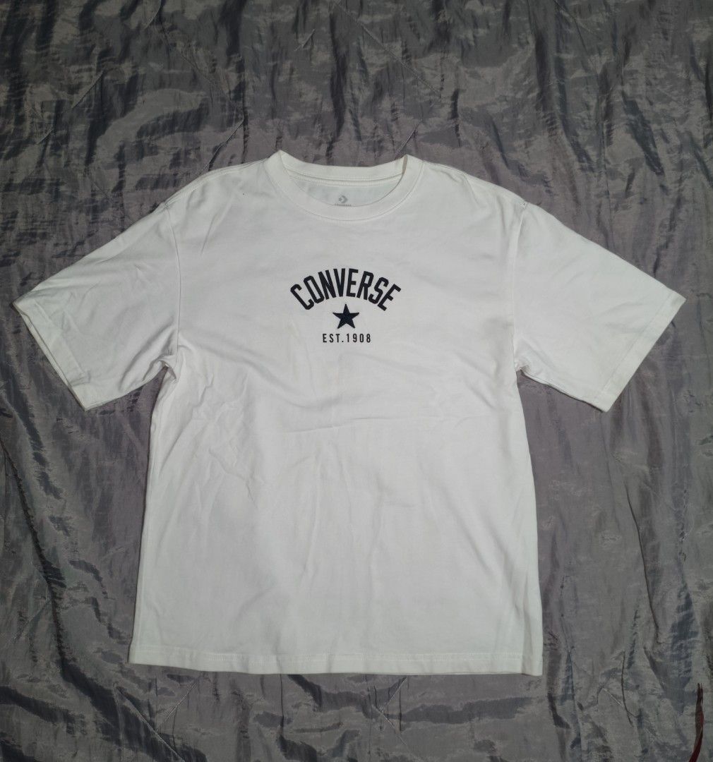 Converse White Graphic Tee Size M (Category: Shirts) located in Polangui. Submitted by quongmarka50283 (Listing ID 1466674936, Image 1). Description: dimes:25/19 color rate:9/10 nees wash.