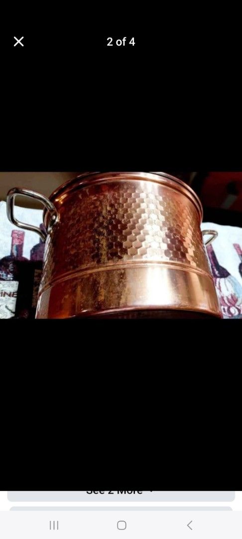 Copper Pot with Glass Lid and Steamer Insert (Category: Cookware & Accessories) located in Cainta. Submitted by veronica2277 (Listing ID 1466690378, Image 2). Description: - Elegant copper pot with dual handles - Includes a clear glass lid and a stainless steel steamer insert with a middle handle - Shiny hammered exterior finish with minor patina and discoloration near the bottom edge - Clean and metallic cooking interior - Great addition to your