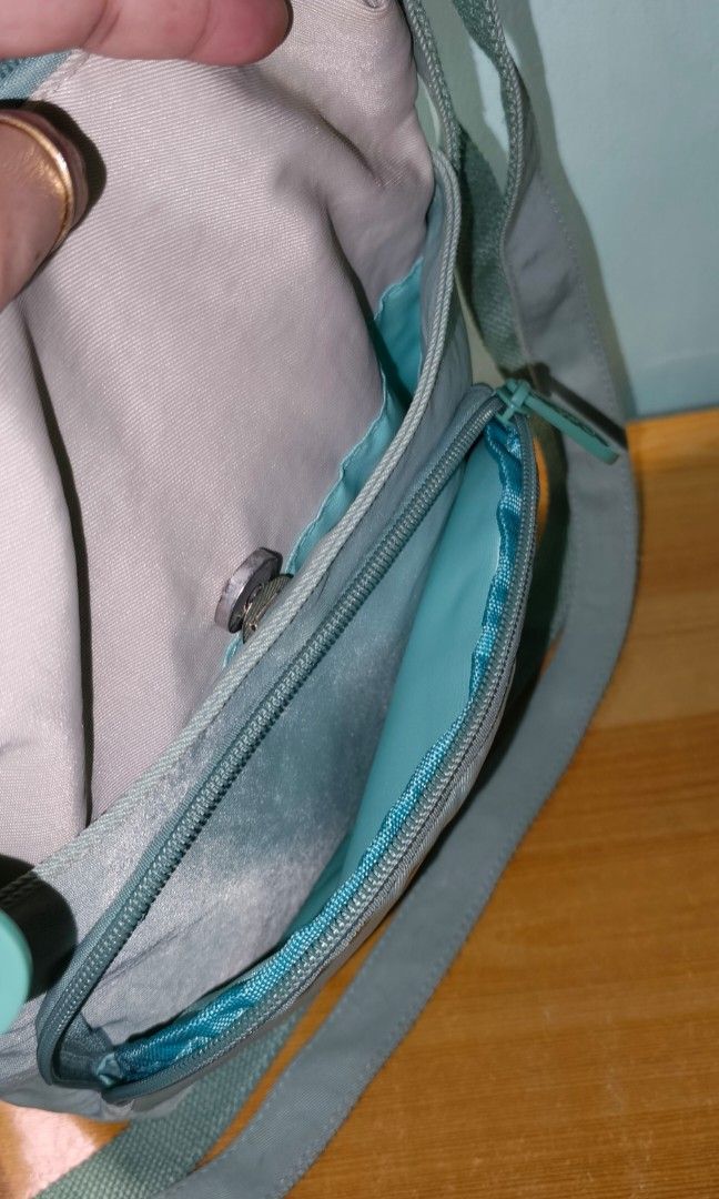 COSĒ BAG (Category: Cross-body Bags) located in Rizal. Submitted by baltiq (Listing ID 1466658377, Image 3). Description: COSĒ Brand from SM Dept. Store ✔soft nylon canvass material ✔sage green, khaki color combo ✔thick strap, adjustable ✔4 compartments, zip pocket inside (main) 📌used twice lang then stored, clean inside 📌spot clean nlang sa small stains(see pic) 📌sold as is! 💰MOP: GCash.