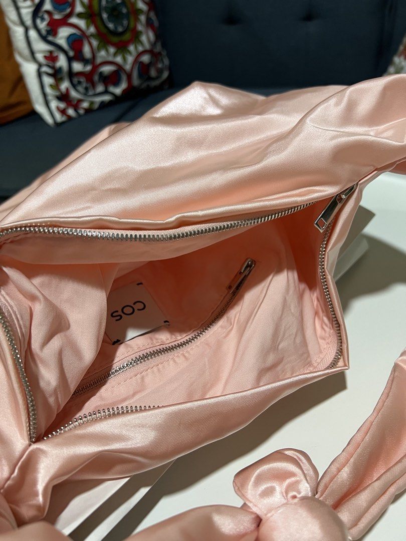 COS Pink Quilted Satin Bag (Category: Shoulder Bags) located in Davao. Submitted by bengscloset (Listing ID 1466650233, Image 3). Description: Brand: COS Color: Satin Baby Pink Material: Silky satin fabric with soft, slouchy shape Details: Knotted strap, top zip closure, and interior zip pocket Condition: Brand new with tags attached 📌 No rush shipping. 📦 Shipping fee c/o buyer. 📍Davao City 💌 Feel free to message me for additional photos/deta