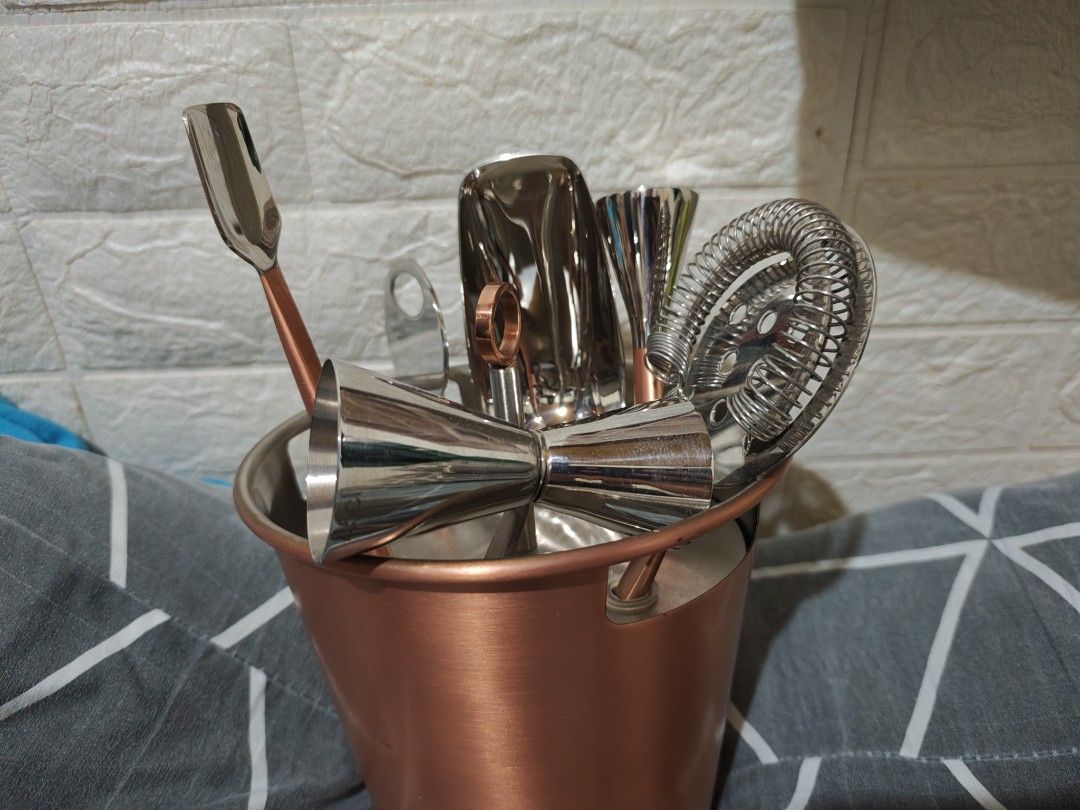 Crate & Barrel Brushed Copper Bar Tool Set (Category: Dinnerware & Cutlery) located in Caloocan City. Submitted by deyburds. (Listing ID 1466720111, Image 1). Description: - Brand: Crate & Barrel - Material/Finish: Brushed copper - Origin: Made in India - Includes: Strainer, jigger, ice scoop, and other cocktail accessories with a matching holder - Condition: Brand new with original store price tag (₱6,299) still attached - Ideal for home bar set