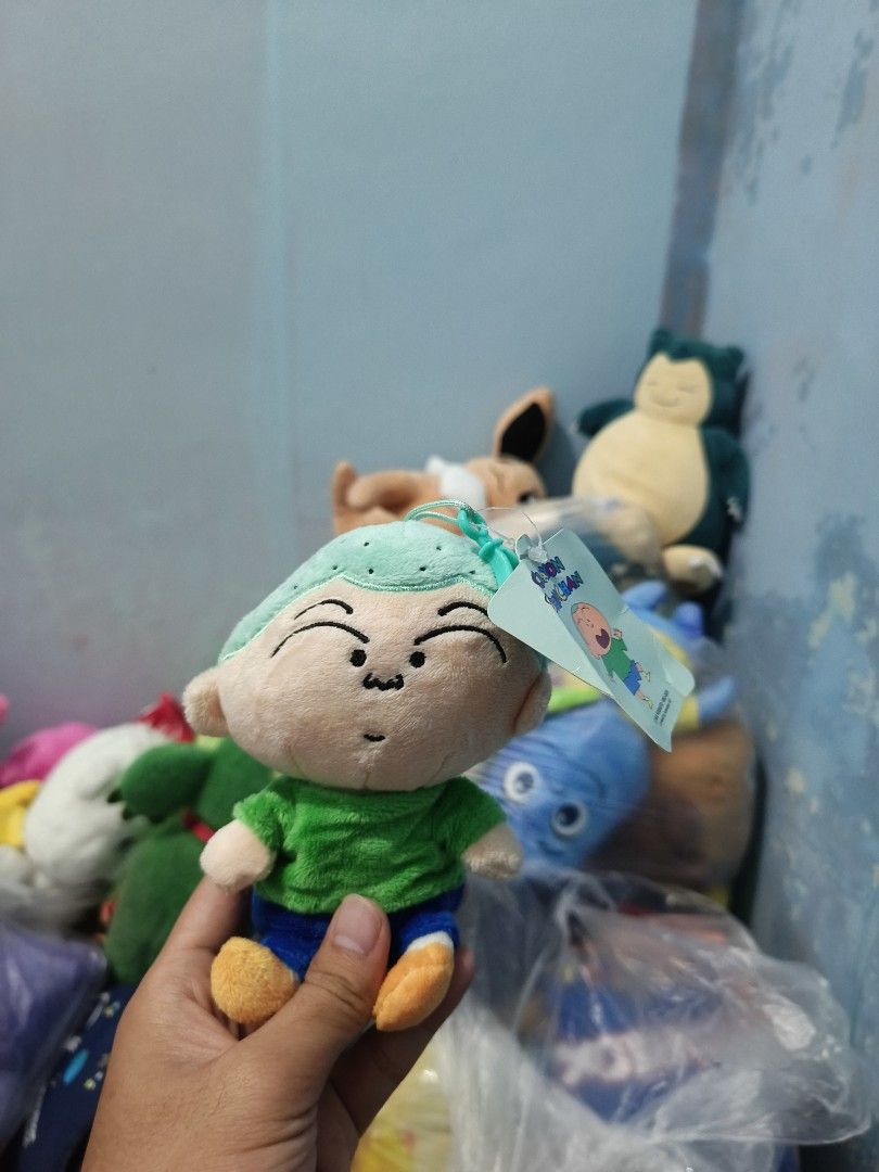 Crayon Shin-Chan Plush Keychain Toy (Category: Plushies & Soft Toys) located in Iligan City. Submitted by sneakymagician (Listing ID 1466705929, Image 1). Description: - Character: Crayon Shin-Chan & Nene chans rabbit - Outfit: Green hair, green shirt, blue shorts, and orange shoes - Material: Soft, huggable plush fabric - Attachment: Sturdy plastic hook strap for easy hanging on bags or keys - Condition: Brand new with tag still attached - Perfe