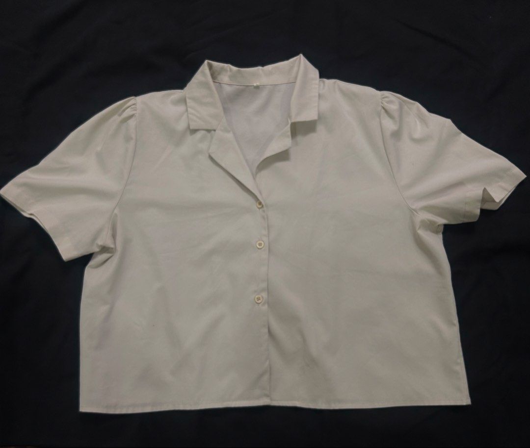 Cream and Dark green polo button down crop top (Category: Shirts) located in Manila. Submitted by ericafelize23 (Listing ID 1466573984, Image 1). Description: - Color: Dark green - Style: Short sleeve button-down - Size: L - Fit: Cropped length, hits at the waist - Condition: good condition, buttons are complete - Care: Clean, washed, and ready to wear.