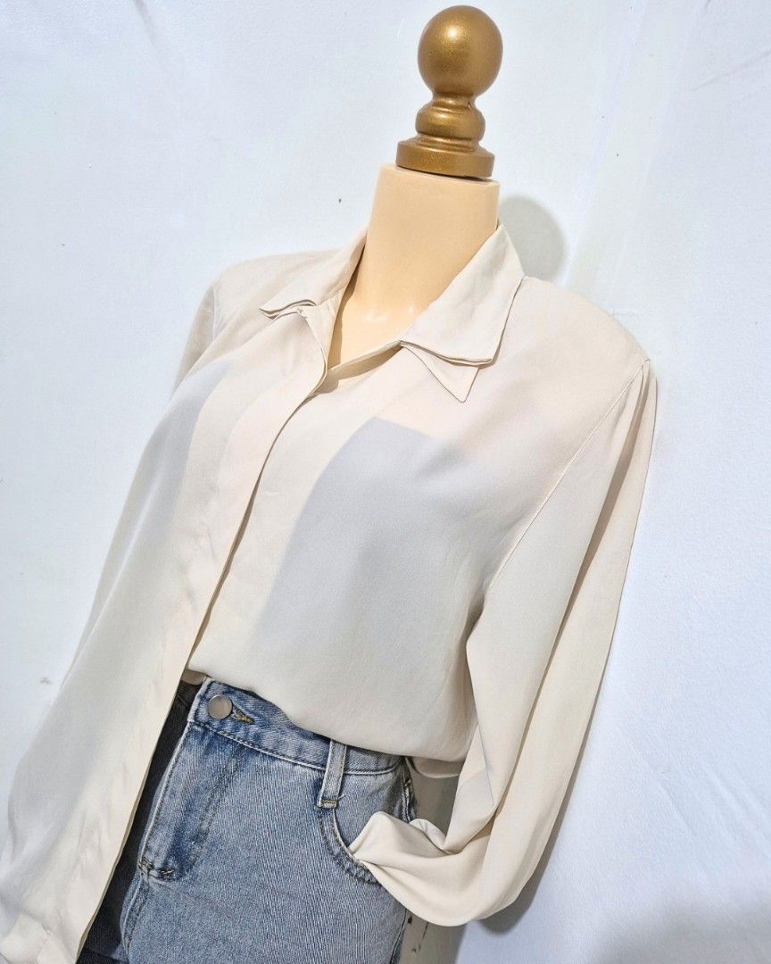 Cream Collared Blouse with Shoulder Pads | L–XL (Category: Longsleeves) located in Cabanatuan. Submitted by _erboutique (Listing ID 1466674640, Image 2). Description: • Soft cream flowy blouse — elegant & effortless ✨ • Collared neckline, subtle shoulder pads for structure • Relaxed fit, lightweight fabric • Size L–XL | Shoulder 17" | Bust 46" | Length 26" • Great condition, easy to dress up or down.