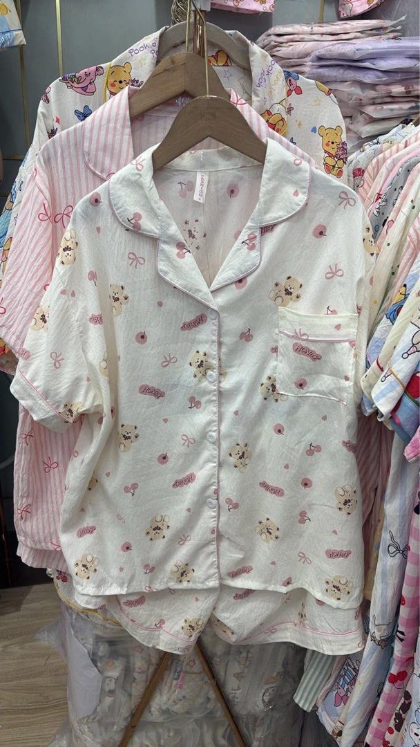 Cute bear print short sleeve pajama set (Category: Undergarments & Loungewear) located in Taguig. Submitted by dlbbb_ (Listing ID 1466604808, Image 1). Description: - Cute teddy bear, cherry, bow, and 'HONEY' print on an off-white base - From BKK 🇹🇭.