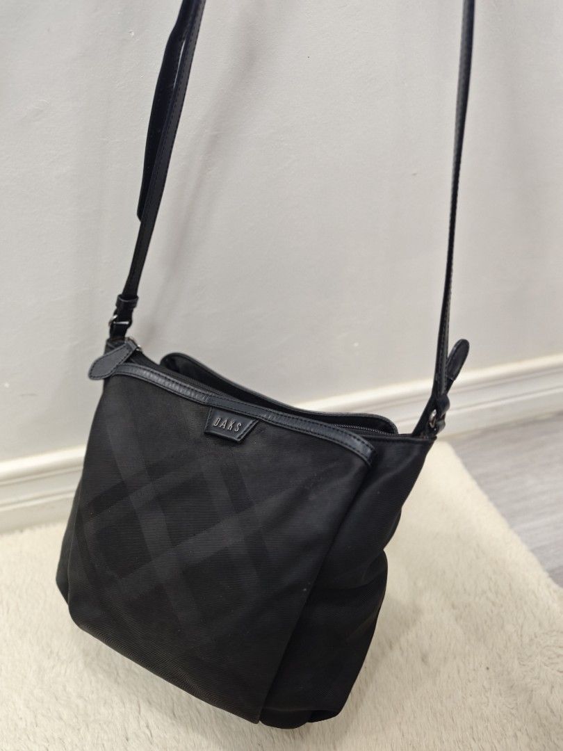 daks sling bag (Category: Luxury Bags & Wallets) located in Panabo. Submitted by kzmbags2026 (Listing ID 1466704725, Image 2). Description: Daks nylon sling bag excellent size: 9" x 9" 880.