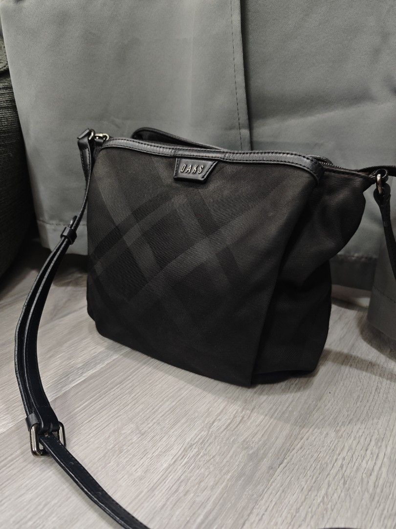 daks sling bag (Category: Luxury Bags & Wallets) located in Panabo. Submitted by kzmbags2026 (Listing ID 1466704725, Image 1). Description: Daks nylon sling bag excellent size: 9" x 9" 880.