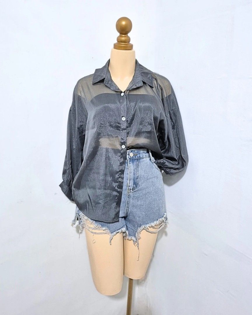 Dark Gray Sheer Shimmer Button-Down Top | L–XL (Category: Longsleeves) located in Cabanatuan. Submitted by _erboutique (Listing ID 1466673288, Image 3). Description: • Dark gray sheer top with subtle shimmer ✨️ • Collared, button-down, relaxed oversized fit • Lightweight & flowy — perfect layered or worn alone • Size L–XL | Shoulder 26½" | Bust 46" | Length 25" • Great condition, ready to wear!.