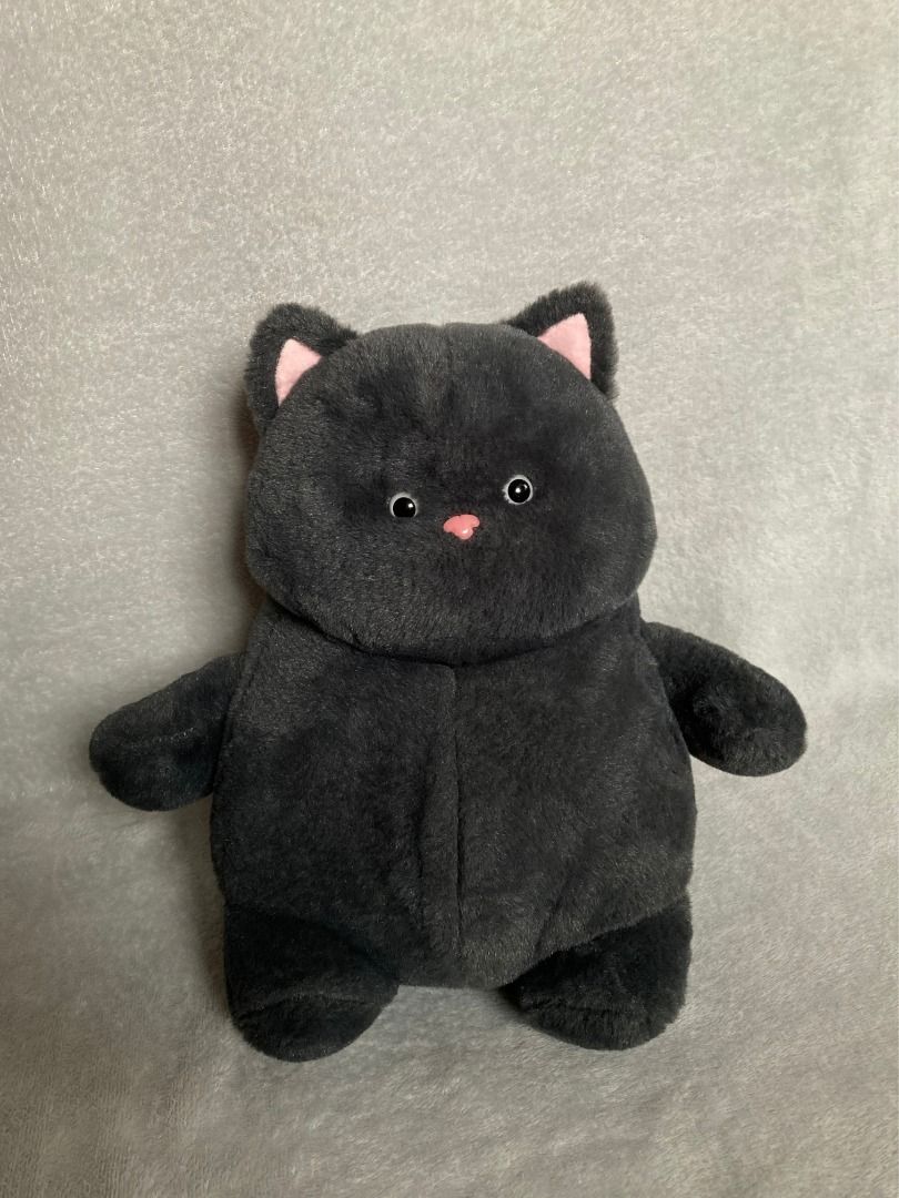 Dark Grey Cat Plush Toy Soft Stuffed Animal (Category: Plushies & Soft Toys) located in Rizal. Submitted by sheeraay (Listing ID 1466647622, Image 1). Description: - Super soft, fluffy black fur - Cute round body with short stubby arms and legs - Detailed with pink inner ears, pink plastic nose, and black button eyes - Features a long tail at the back - Clean and ready for a new home - Perfect cuddle buddy for kids and cat lovers.