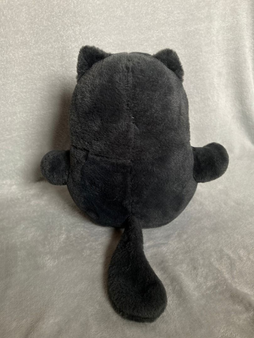 Dark Grey Cat Plush Toy Soft Stuffed Animal (Category: Plushies & Soft Toys) located in Rizal. Submitted by sheeraay (Listing ID 1466647622, Image 3). Description: - Super soft, fluffy black fur - Cute round body with short stubby arms and legs - Detailed with pink inner ears, pink plastic nose, and black button eyes - Features a long tail at the back - Clean and ready for a new home - Perfect cuddle buddy for kids and cat lovers.