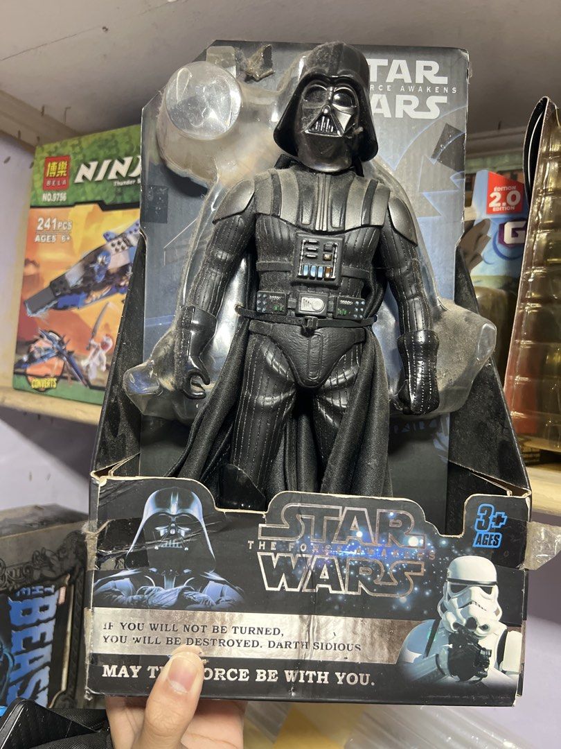 Darth Vader Star Wars The Force Awakens (1:6 Scale) (Category: Figurines & Statues) located in Quezon City. Submitted by thegroovearchive (Listing ID 1466680027, Image 1). Description: - Bootleg 1:6 Star Wars Darth Vader action figure - Comes in original packaging featuring iconic quotes from Darth Sidious and Darth Vader - Detailed design including his signature black suit, flowing cape, and helmet - Recommended for ages 3 and up - Note: Box sho