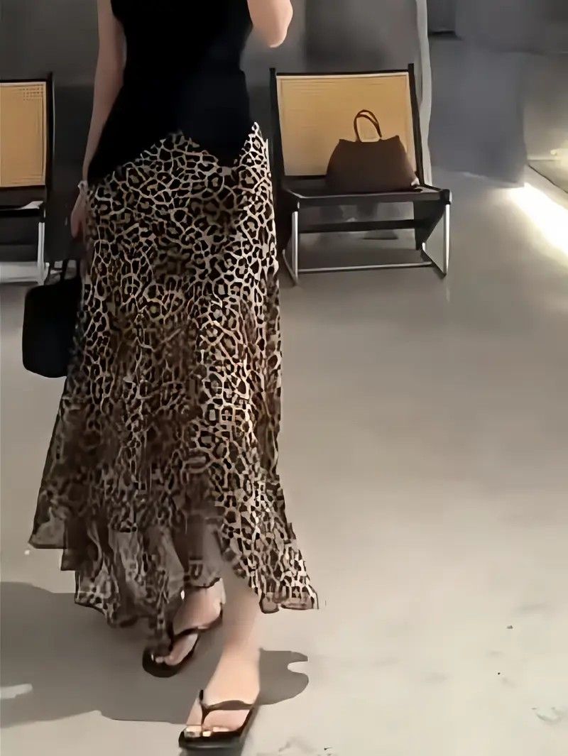 DEHRY LEOPARD SKIRT Y2K VINTAGE (Category: Skirts) located in Manila. Submitted by icamalicdem29 (Listing ID 1466647363, Image 1). Description: vintage René Derhy leopard print asymmetrical maxi/midi skirt (or a high-low style dress hemline) featuring a sheer chiffon outer layer, a ruffled lettuce hem, and a solid black built-in underskirt lining. The french designer brand René Derhy is well-known for its bohemian, Y2K-era, and whimsical designs 