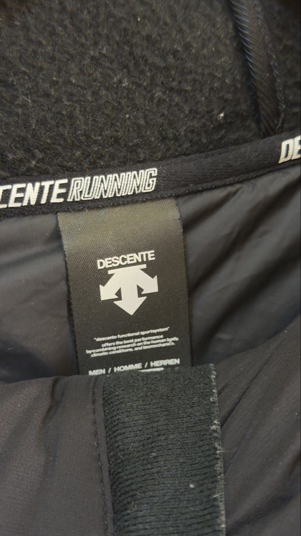 Descente Running Hooded Jacket (Category: Coats, Jackets and Outerwear) located in Paranaque City. Submitted by preluxeshop_ph (Listing ID 1466768422, Image 3). Description: Descente Running Hooded Jacket -Design: Hooded running jacket -Features: Quilted front, fleece sleeves, zip closure, pockets -Condition: 9.8/10 -Dimes: Length: 26.5” Width: 21”.