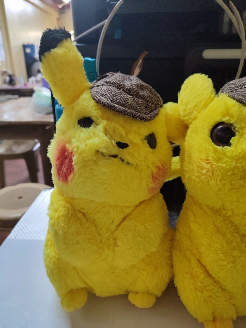 Detective Pikachu Plush Toy Pokémon (Category: Plushies & Soft Toys) located in Manila. Submitted by shop_eyy (Listing ID 1466768215, Image 3). Description: - 150 each po. if take all 400 na lang po. -Official Pokémon Detective Pikachu plush figure - Features iconic brown houndstooth detective hat - Vibrant yellow furry body with red cheeks and black-tipped ears - Made with soft, huggable textured material in a cute sitting posture - Official tag