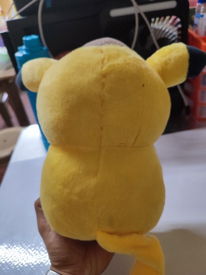 Detective Pikachu Plush Toy with Brown Hat (Category: Plushies & Soft Toys) located in Manila. Submitted by shop_eyy (Listing ID 1466768231, Image 2). Description: - Adorable Detective Pikachu plush wearing a signature brown hat - Soft, fluffy fabric with embroidered smile and round black eyes - Great size for hugging or shelf display - Perfect addition to your room setup or collection -no brand.