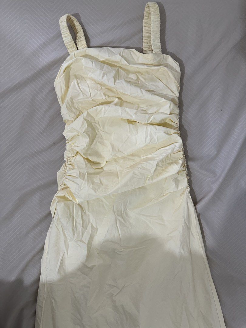 Dexus Yellow Long Dress Size S (Category: Dresses) located in Lipa City. Submitted by chiechums (Listing ID 1466642096, Image 3). Description: - Brand: Dexus - Color: Vibrant yellow - Size: S (Fits EUR/US/MEX 36) - Design details: Gathered ruching on straps, bodice, and sides - Closure: Back zipper - Origin: Made in Vietnam.