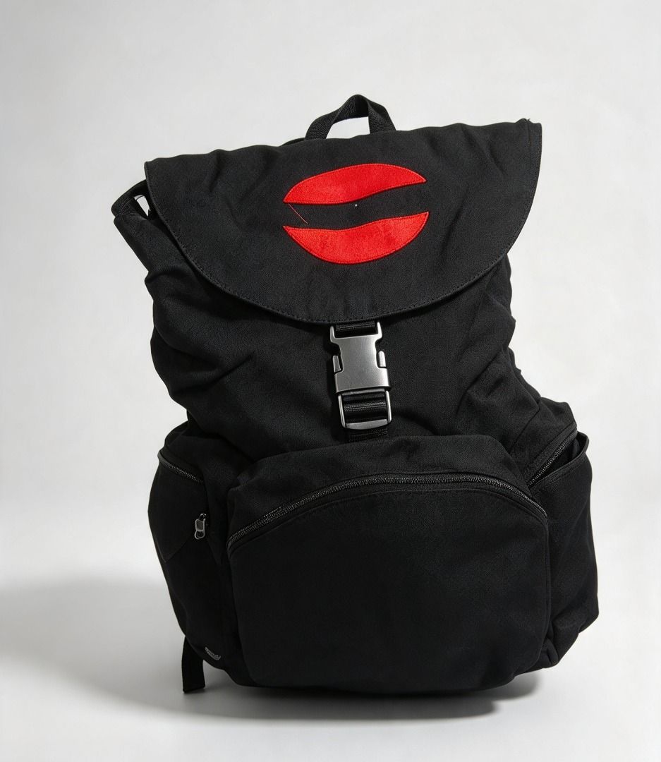 Dickies Black Backpack Red Lips Logo (Category: Backpacks) located in Valenzuela. Submitted by gentleforest_55bce9 (Listing ID 1466746725, Image 1). Description: - Brand: Dickies - Color: Classic black canvas with red embroidered lips design - Storage: Roomy main compartment, front zipper pocket, and side pockets - Closure: Secure buckle closure - Straps: Adjustable shoulder straps with classic Dickies woven logo tag - Lining: Solid black durable