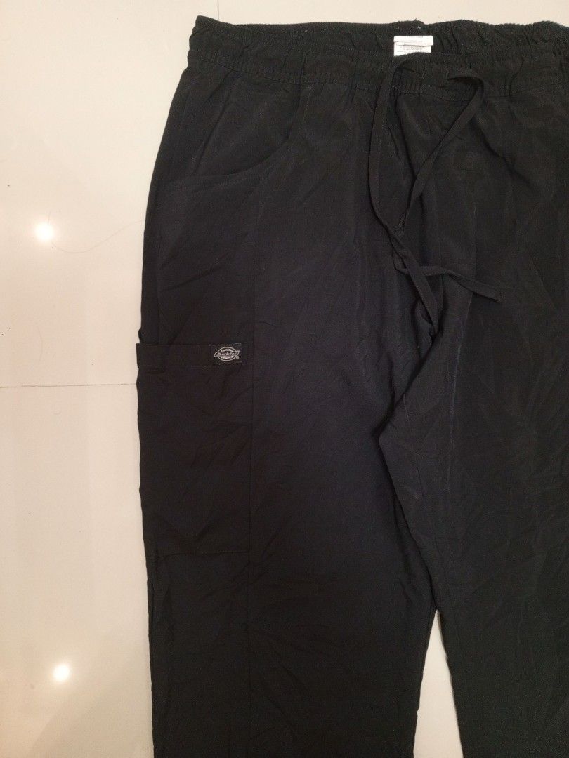 Dickies Black Cargo Scrub Pants Drawstring (Category: Trousers) located in Orani. Submitted by thriftniea (Listing ID 1466569674, Image 2). Description: DICKIES SIZE 34-38 LENGTH 38 ISSUE ADHESIVE CHECK ON LAST PICS.