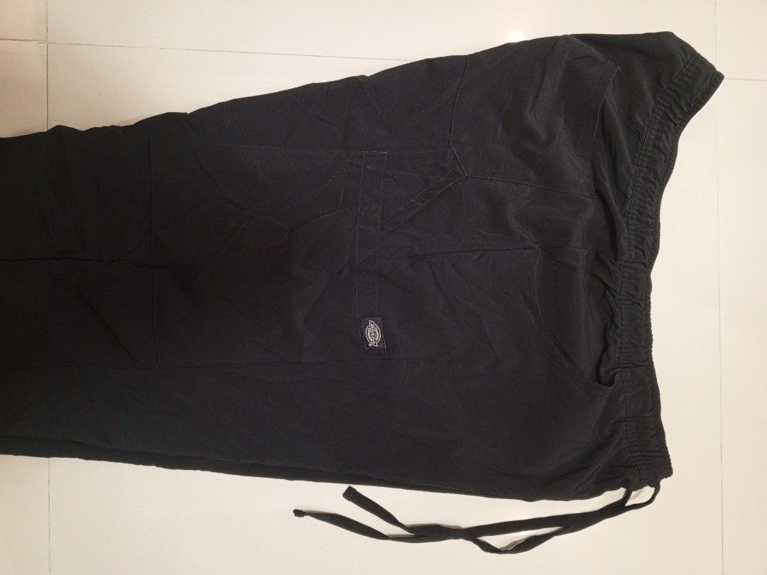 Dickies Black Cargo Scrub Pants Drawstring (Category: Trousers) located in Orani. Submitted by thriftniea (Listing ID 1466569674, Image 3). Description: DICKIES SIZE 34-38 LENGTH 38 ISSUE ADHESIVE CHECK ON LAST PICS.