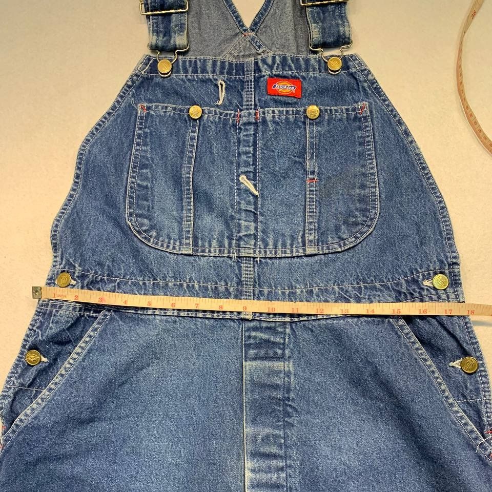 Dickies Denim Overalls Blue Workwear (Category: Jumpsuits) located in Mandaluyong City. Submitted by theroom501 (Listing ID 1466610519, Image 3). Description: Dickies Denim Overalls Blue Workwear Style Code: Size on Tag: Color: Blue Condition: Good pre-owned condition with a heavily distressed vintage look. Flaws/Issues: peeling on the tag. Flat Lay Measurements: Pit to Pit: 34 inches Length: 58 inches Leegopening Length: 10 inches Price: 2500.