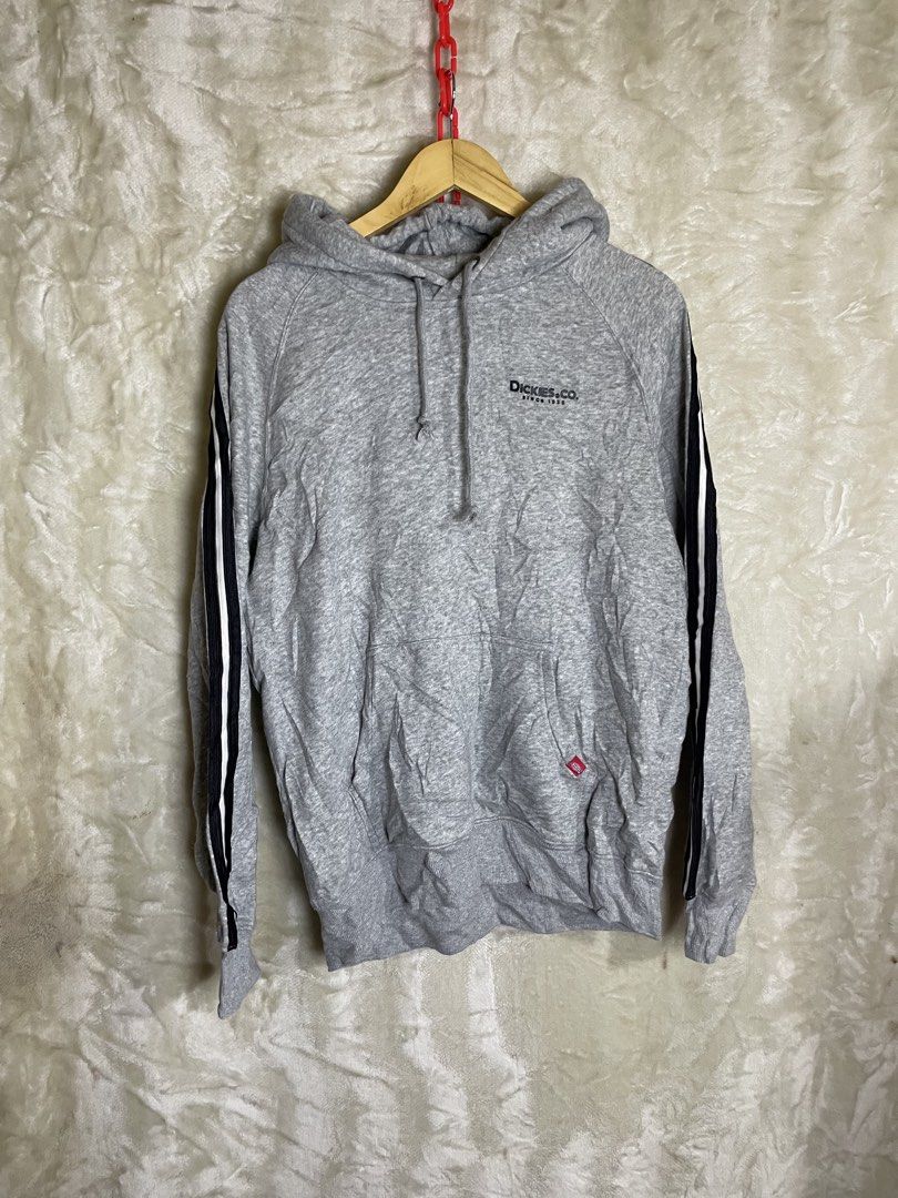 Dickies Grey Hoodie Size M (Category: Hoodies) located in Molave. Submitted by charlesthrifter (Listing ID 1466584226, Image 1). Description: - Brand/Model: Dickies hoodie - Color: Grey with black and white side stripes - Size: Medium (fits large size) - Details: Front kangaroo pocket, small red logo tab, drawstring hood, ribbed cuffs - Condition/Use: Comfortable everyday sweatshirt, great for cooler weather.