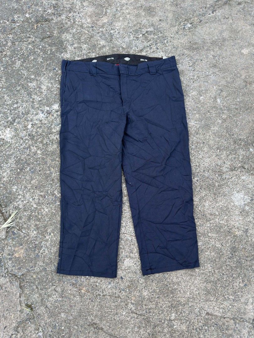 Dickies Slim Fit Navy Work Pants (Category: Trousers) located in Urdaneta. Submitted by goldeneagle-e662 (Listing ID 1466664358, Image 2). Description: - Brand: Dickies - Color: Navy Blue (Dark tone) - Fit: Slim fit - Details: Standard belt loops, rear welt pocket with classic Dickies logo patch, inner waistband label - Style: Clean, versatile, and easy to match with any shirt or hoodie - Condition: Solid daily rotation piece.