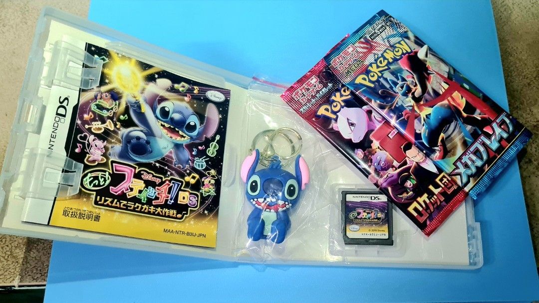 🎃Disney Stitch! DS Game, Keychain, and Pokémon Packs bundle (Category: Nintendo) located in Manila. Submitted by cats_and_dogs_charity (Listing ID 1466675911, Image 2). Description: - Title: Disney Stitch! Rhythm de Rakugaki Daisakusen for Nintendo DS (Japanese import) - Includes original game case, manual, and an unopened Stitch rubber keychain - Bonus: 2x unopened Pokémon TCG booster packs featuring Team Rocket and Mega Lucario artwork - Condi