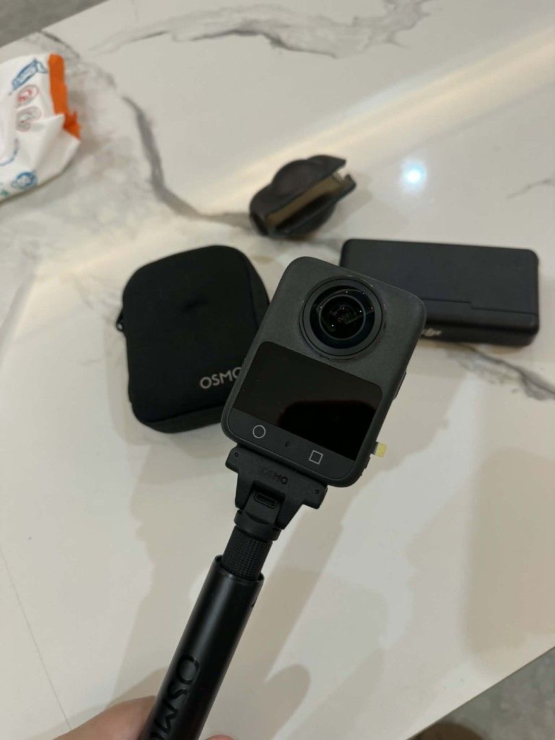 DJI Osmo Action 3 camera bundle with extension rod (Category: Other Gadgets) located in Pasay City. Submitted by pepper1997 (Listing ID 1466653784, Image 1). Description: - Complete DJI Osmo Action camera bundle - Includes main camera unit, extension selfie pole, protective case, lens cover, and battery charging case - Ideal setup for vlogging and outdoor action shots - Clean condition and fully functional - Grab it before it's gone!.
