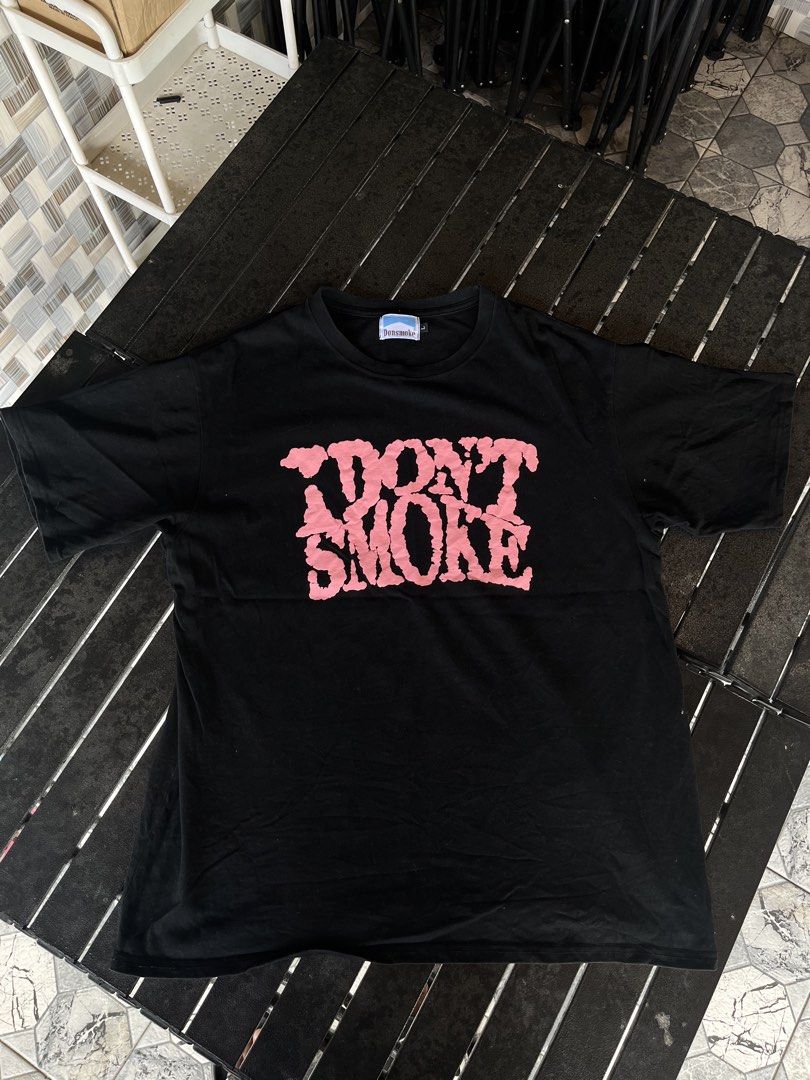 Donsmoke I Don't Smoke (Category: Tshirts & Polo Shirts ) located in Tuguegarao City. Submitted by josh_the_thrift (Listing ID 1466571910, Image 1). Description: - Brand: Donsmoke - Color: 9/10 Black,may vary due to lightning - Material: 100% Cotton - Size: 22x28 Large - Design: Bold pink 'I DON'T SMOKE' graphic in a distressed, melting style on the chest .