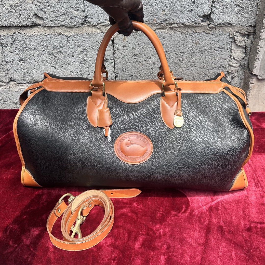 Dooney & Bourke All weather weekender bag. (Category: Luxury Bags & Wallets) located in Cagayan de Oro. Submitted by kjcartier26 (Listing ID 1466632920, Image 1). Description: Authentic Dooney & Bourke Bag. 🇯🇵✨ - 56k in peso for this preloved bag. 😱😱 - In excellent condition. - With strap, Adjustable and Flawless - Clean inside/Outside, Working zippers. .