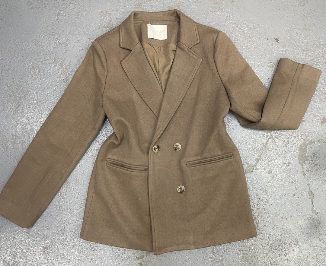 DoubleV Brown Double-Breasted Blazer Jacket (Category: Coats, Jackets and Outerwear) located in Bulacan. Submitted by grazcloset (Listing ID 1466589630, Image 1). Description: NOTE : NO WHEN WORN - Brand: DoubleV - Color: Warm brown neutral - Style: Double-breasted with matching buttons and classic lapel - Fit: Tailored body fit - Features: Two front welt pockets, fully lined interior for smooth layering - Versatility: Ideal for office wear and s