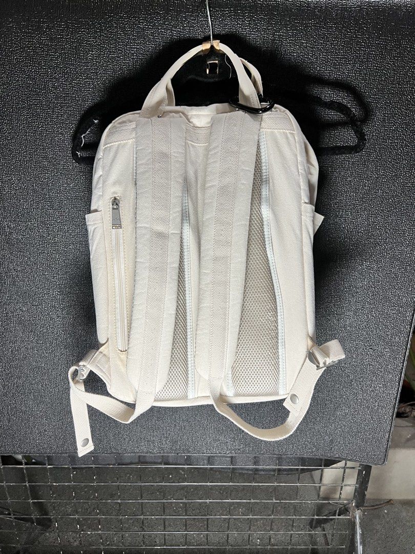 Doughnut Organic Cotton Cream Backpack (Category: Backpacks) located in Taytay. Submitted by cside1900 (Listing ID 1466698389, Image 3). Description: - Material: Premium cream organic cotton with stylish brown leather-look accents - Comfort: Adjustable shoulder straps and back panel with breathable mesh padding - Storage: Multiple interior organizing compartments and secure back zipper closure - Details: Chic metal hardware on the front pocket an