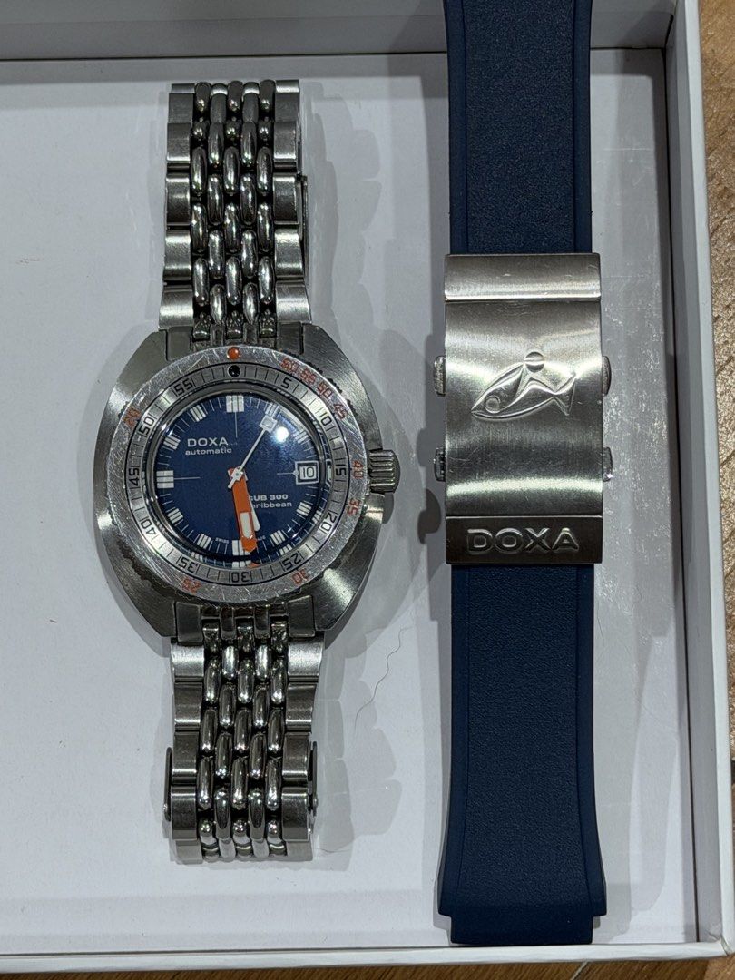 Doxa Sub 300 Caribbean (Category: Men's Watches) located in Butuan. Submitted by swiftflower.6836d6 (Listing ID 1466655055, Image 2). Description: MOVEMENT Swiss mechanical automatic, self-winding, COSC certified Chronometer Power reserve 38 hours CASE Stainless steel case Diameter 42.50 mm x 45.00 mm Height 13.40 mm Screw-down crown Water resistance 30 ATM / 300 meters / 984 feet Stainless steel, screw down case back In good condition. Purchased