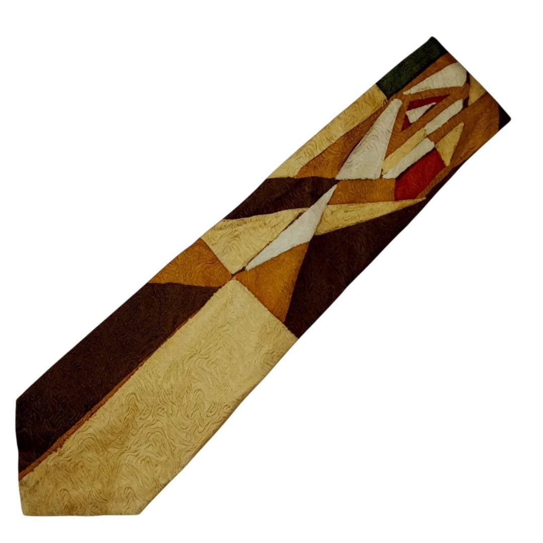 Earth Tone Abstract Geometric Textured Tie (Category: Ties) located in Abucay. Submitted by gibzzz123 (Listing ID 1466643949, Image 1). Description: • All items are ON HAND and ready to be shipped/picked up. • Items are preloved/ukay, so please expect minimal signs of usage unless stated otherwise. • No major issues — good condition unless otherwise indicated in the listing. • Actual color may slightly vary due to lighting and screen settings. • 
