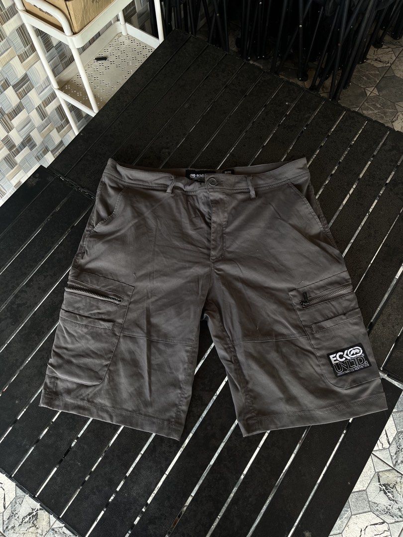 Ecko Unltd Cargo Shorts (Category: Shorts) located in Tuguegarao City. Submitted by josh_the_thrift (Listing ID 1466570360, Image 1). Description: - Brand: Ecko Unltd - Size: 36x32 - Color: Grey - Features: Multiple utility pockets with zippers on the sides, iconic rhino logo patch on the left leg - Condition: may himulmol na part.