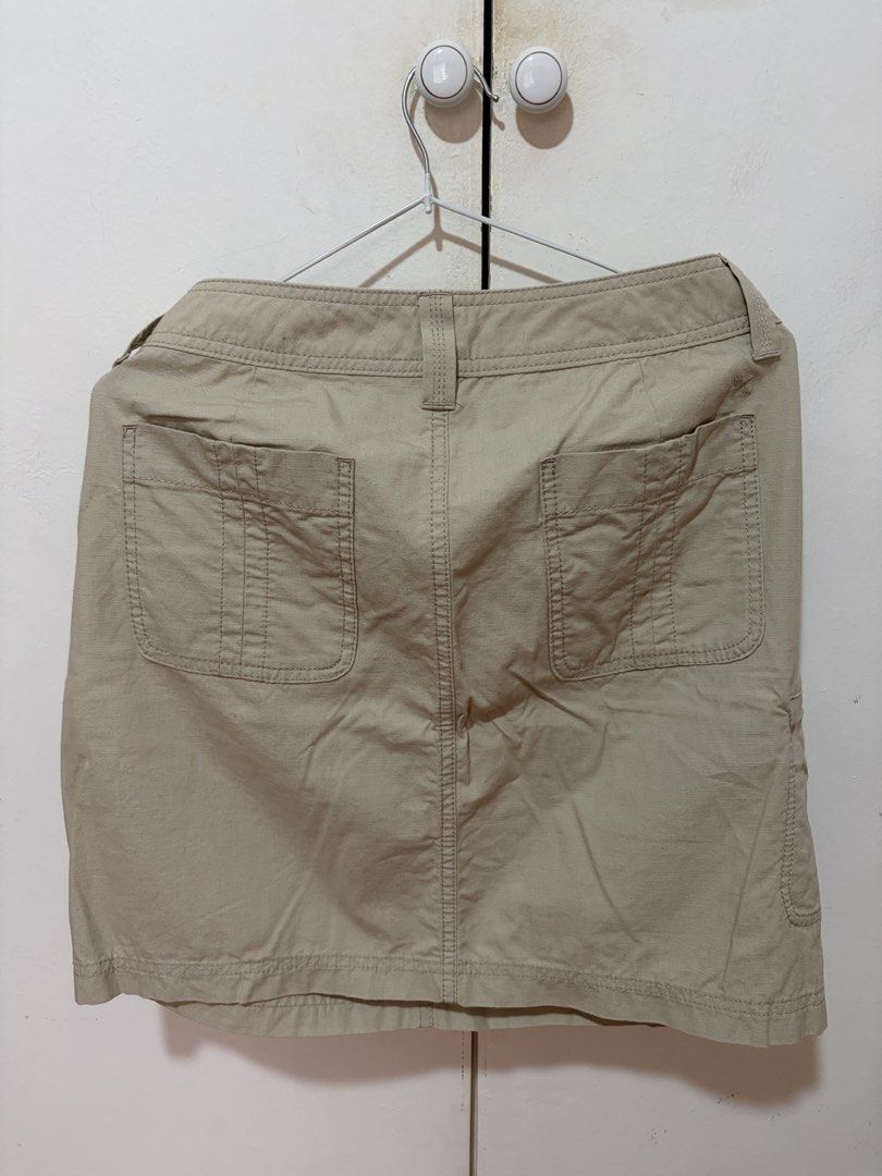 Eddie Bauer Khaki Cargo Skirt (Category: Skirts) located in Dasmarinas. Submitted by luvaide (Listing ID 1466599418, Image 2). Description: - Brand/Style: Eddie Bauer Women's Cargo Skirt - Size: 6 - Color: Classic khaki beige - Material: Sturdy utility-style fabric - Features: Button and zipper fly, front slash pockets, side cargo pocket, two button-flap back pockets - Condition/Use: Great neutral piece for casual wear, hiking, and outdoor outing