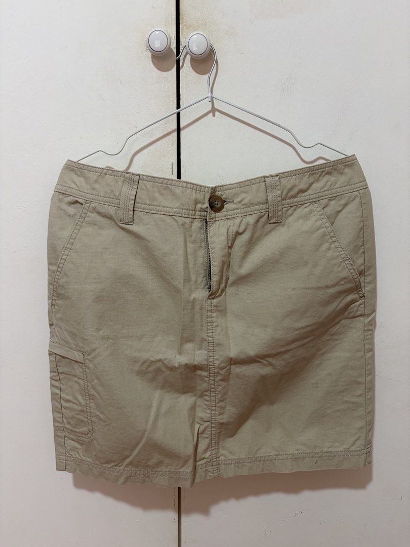 Eddie Bauer Khaki Cargo Skirt (Category: Skirts) located in Dasmarinas. Submitted by luvaide (Listing ID 1466599418, Image 1). Description: - Brand/Style: Eddie Bauer Women's Cargo Skirt - Size: 6 - Color: Classic khaki beige - Material: Sturdy utility-style fabric - Features: Button and zipper fly, front slash pockets, side cargo pocket, two button-flap back pockets - Condition/Use: Great neutral piece for casual wear, hiking, and outdoor outing