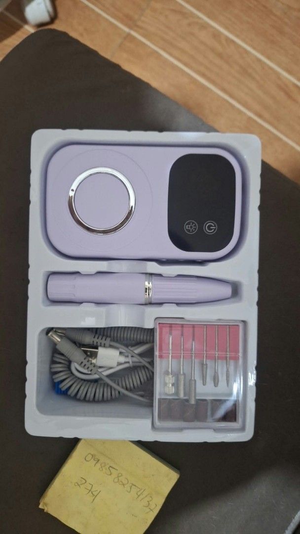 Electric Nail Polisher Drill Set with Bits (Category: Hands & Nails) located in Quezon City. Submitted by nobledeer.dc87f4 (Listing ID 1466623493, Image 1). Description: - Cute pastel electric nail polisher kit - Ideal for home manicures and pedicures - Includes main console unit, handpiece, and charging cable - Complete set of interchangeable drill bits and sanding bands included - Compact and lightweight design - Neatly organized in the origina
