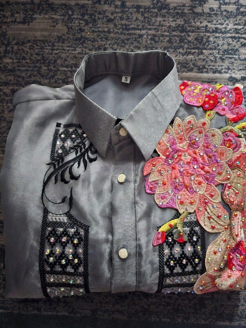 Embroidered Button-Down Shirt with Rhinestones (Category: Formal Shirts) located in Manila. Submitted by villoja0615 (Listing ID 1466589273, Image 1). Description: - Set of 2 statement button-down shirts: 1 grey (Size S) and 1 black - Eye-catching rhinestones and vibrant colorful floral embroidery - Unique embroidery designs featured on the chest and collar areas - Long sleeves with classic front button closures - Perfect standout pieces for part