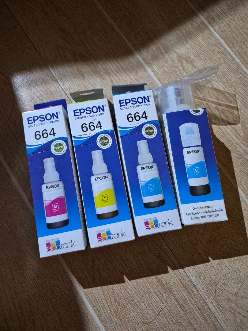 Epson 664 EcoTank Genuine Ink (Category: Printers, Scanners & Copiers) located in Taguig. Submitted by mvgc04 (Listing ID 1466641074, Image 1). Description: 200 each - Authentic Epson 664 EcoTank ink refill bottles - Bundle includes: 2 Cyan, 1 Magenta, 1 Yellow - 100% genuine Epson products - Brand new, boxes sealed in original packaging (nasira lang yung box nung isang cyan pero sealed pa rin yung plastic) - Extra stock from printer upgrade, no 