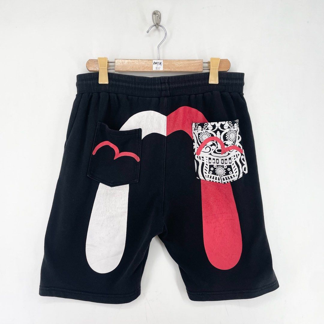 Evisu Black Split Red And White Daicock Sweat Shorts (Category: Shorts) located in Manila. Submitted by buzz.garments (Listing ID 1466673389, Image 1). Description: Size: XL Dimensions(inches) -Waist/Width: 34-46” (Strechable) -Hip: 22” -Front Rise: 15” -Thigh: 13” -Inseam: 8” -Outseam/Length : 22” -Leg Opening: 10” cut tags, hairlines, signs of usage - color may vary due to lighting. please manage your expectations-minimal and unseen flaws must 