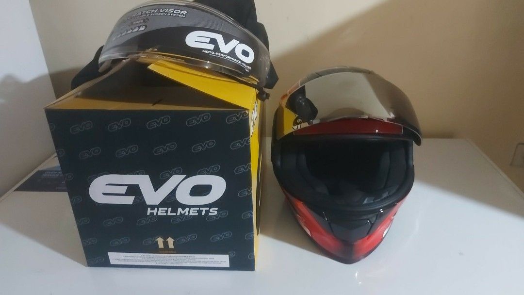 EVO Cyclone Full Face Motorcycle Helmet with Extra Visor (Category: Motorbikes for Sale) located in Manila. Submitted by pretty0099 (Listing ID 1466627892, Image 1). Description: EVO Cyclone full face helmet in red, black, and white. DOT certified safety rating. Comes with the original box and a spare tinted visor. Glossy finish with aerodynamic spoiler design. Interior padding is clean and intact. Never used outdoors, only opened for photos..