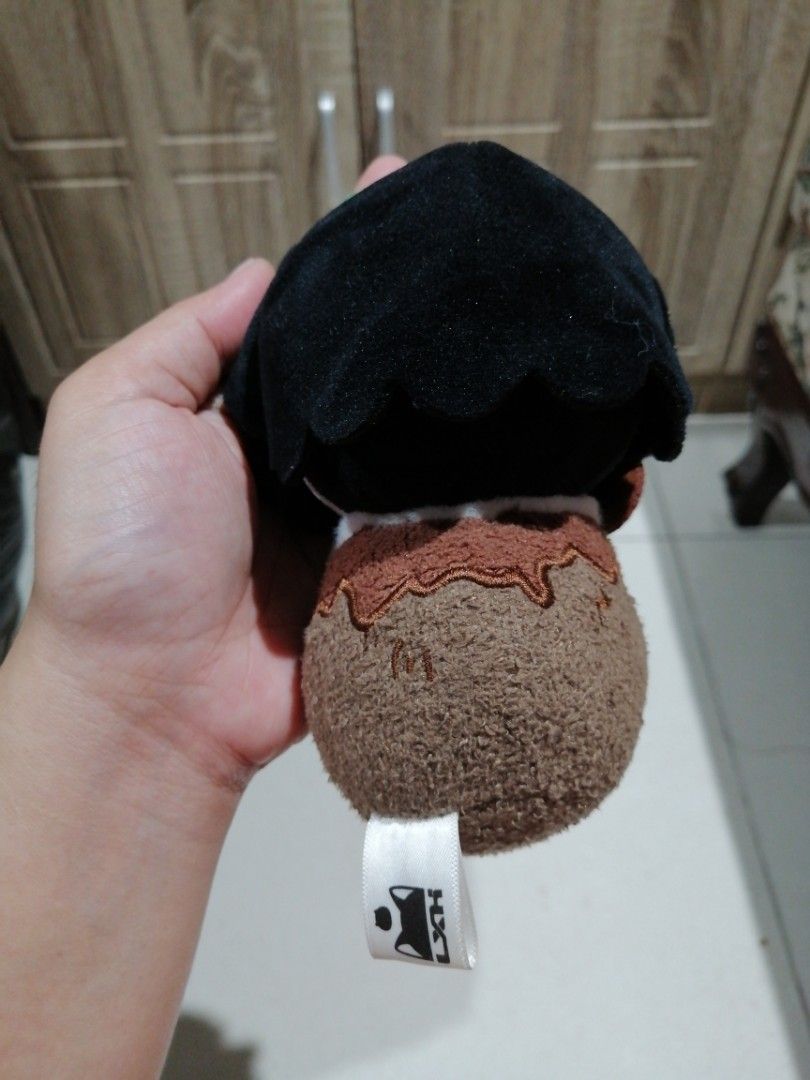FANSZ Character Plush Keychain (Category: Plushies & Soft Toys) located in Angono. Submitted by rlinee_93 (Listing ID 1466697998, Image 3). Description: - Brand: Authentic FANSZ plush character keychain - Design: Black hair, striking green eyes, and holding a tiny spoon - Details: Brown round base with realistic stitching and signature FANSZ tag - Attachment: Includes a durable green ball chain for easy hanging - Condition: Brand new, perfect for