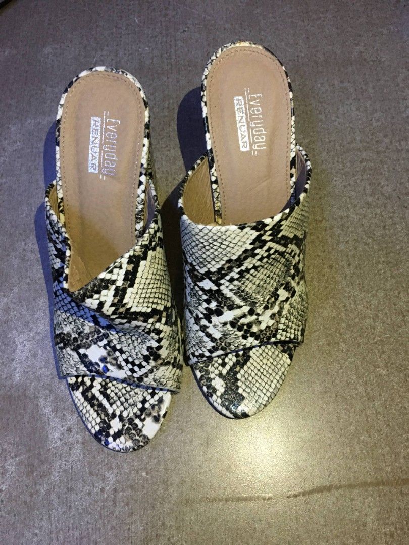 Faux Leather Snakeskin Mules Wedge Heels (Category: Sandals) located in Quezon City. Submitted by lizzyslittleletgos (Listing ID 1466571583, Image 2). Description: ☆ RENUAR ☆ size 36-37 ☆ 3 inches heels ☆ has minor flaws inside the mules but barely noticeable, still in good condition..