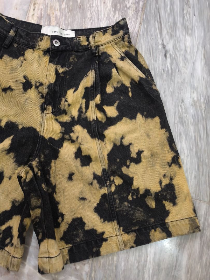 Feng Chen Wang Tie-Dye Denim Short - AW22 (Category: Shorts) located in Lucena. Submitted by 0174.archive (Listing ID 1466681850, Image 2). Description: very good used condition no flaws size m on tag Actual Measurements (inches) Waist: 15 / 30 around Inseam: 9.5 Out seam: 22 Front Rise: 14.5 Thigh: 16 Leg opening: 16 Message before buying if you have question Items are new / pre-loved / second hand used Manage your expectations Buy with confiden