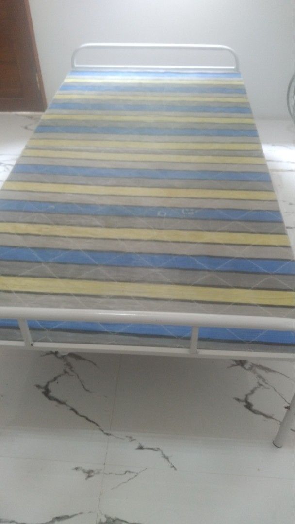 Foldable Single Bed (Category: Bed Frames & Mattresses) located in Quezon City. Submitted by declutter1990 (Listing ID 1466662279, Image 3). Description: ISSUE: MAY RUST SA BODY PARTS.