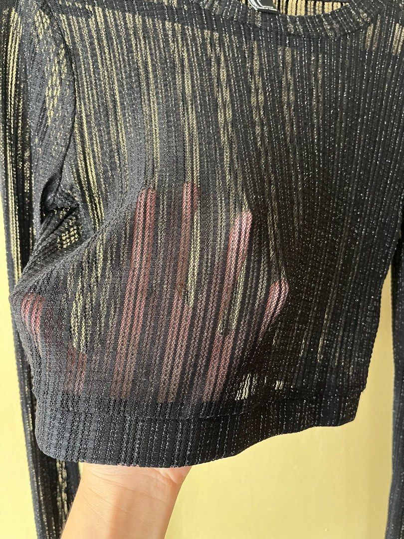 Forever 21 Black Shimmer Mesh Crop Top (Category: Sleeveless) located in Cebu City. Submitted by purgemycloset (Listing ID 1466636047, Image 3). Description: - Brand: Forever 21 - Color: Black with silver shimmer - Size: Small (Tag: 160/84A) - Material: Sheer, highly stretchable ribbed knit - Features: Long sleeves, round neckline, cropped fit - Style: Great for layering or night out looks.