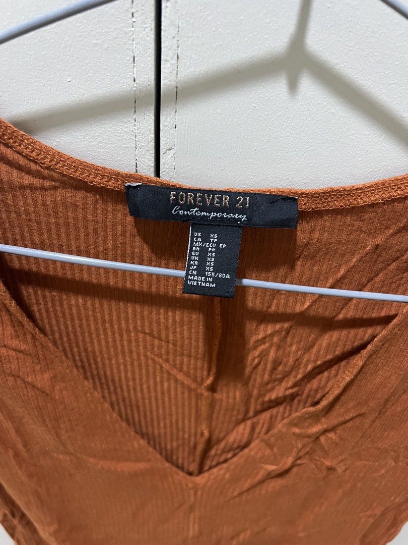 Forever 21 Contemporary Brown Ribbed V-Neck Top (Category: Sleeveless) located in Makati City. Submitted by dcal29 (Listing ID 1466697202, Image 2). Description: .